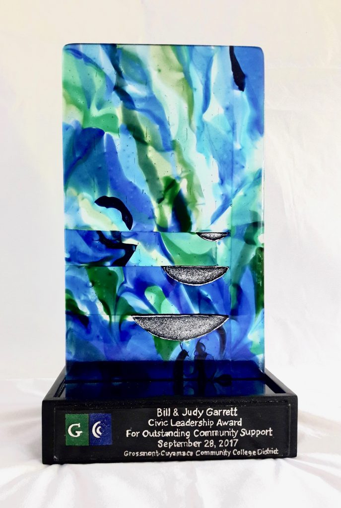 Caron Art Glass fused glass sculpture GC Community Service award hand raked glass dichroic glass blue green silver rectangle black granite wood enamel base