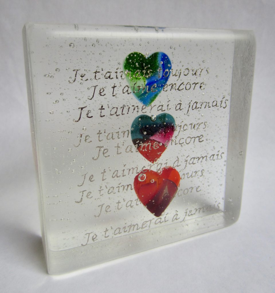 Caron Art Glass fused glass sculpture anniversary gift glass block Je t'aime (I Love You) hand painted details three hearts blue green red pink square