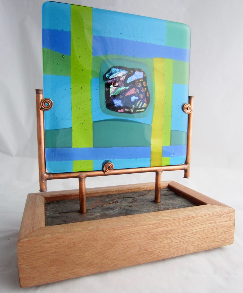Caron Art Glass fused glass sculpture Corporate Gift Ke Ao Nani- I Lalo (Our Beautiful World- The Land) dichroic glass turquoise blue green yellow square copper slate wood base