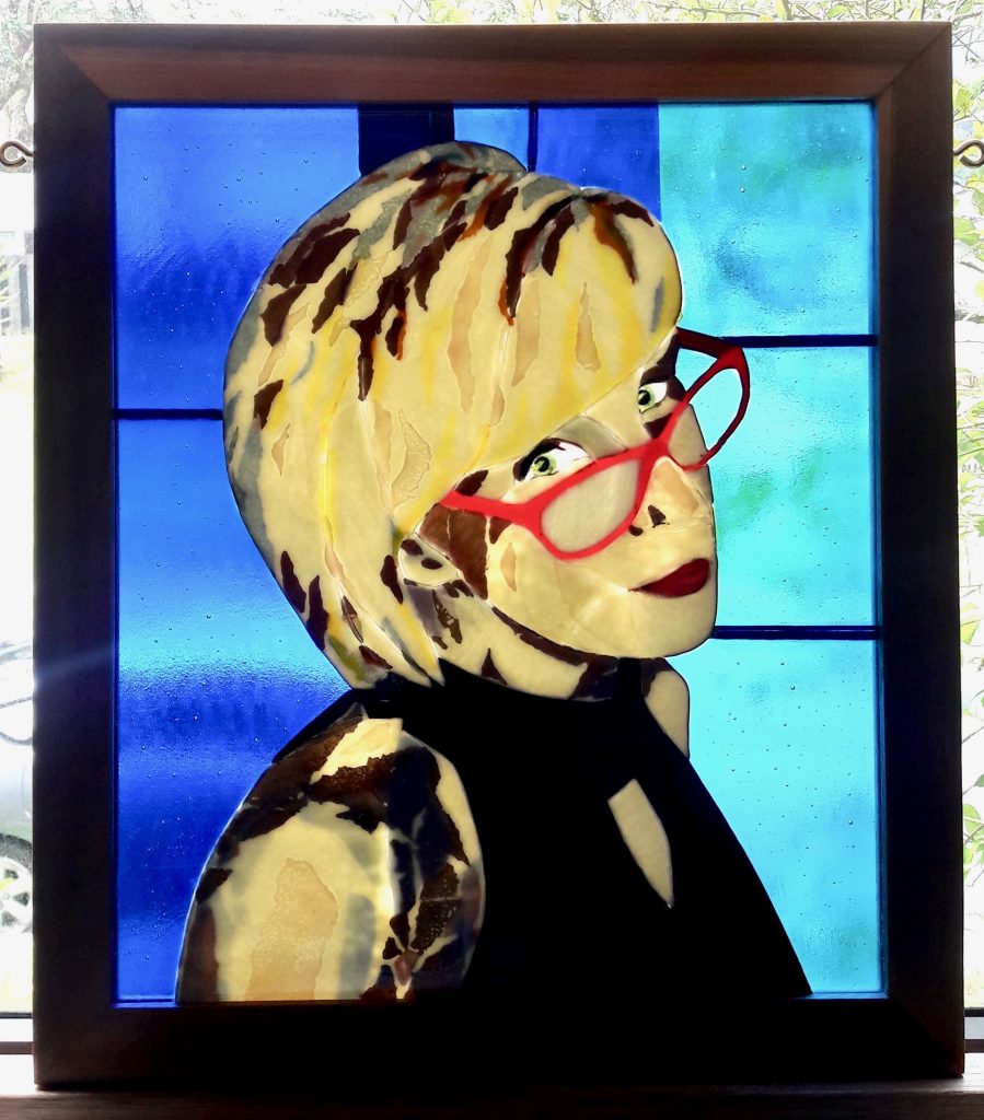 Caron Art Glass stained glass panels memorial portrait Shannon fused glass backlit woman red glasses blue yellow red black rectangle mahogany frame