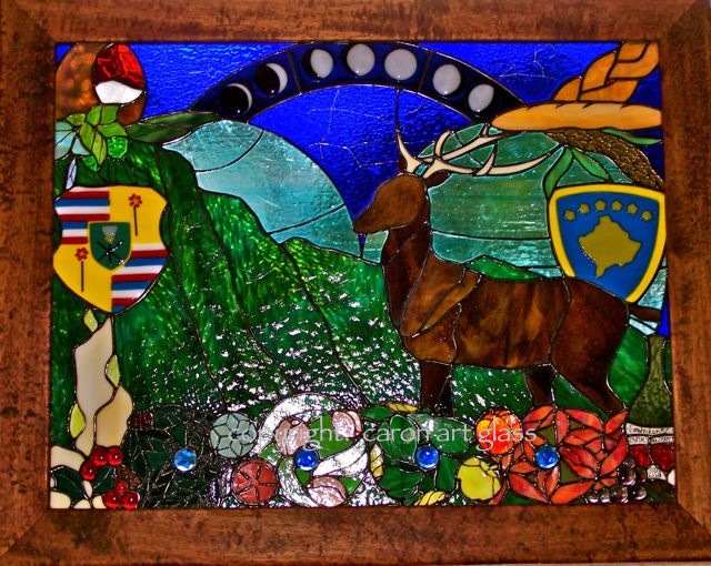 Caron Art Glass Michelle Caron stained glass panel fused glass Hawaii Kosovo wedding gift It's a Small World Kosovo Hawaii buck mountains shields moon phases seasons flowers blue green turquoise amber yellow orange red blue rectangle koa frame