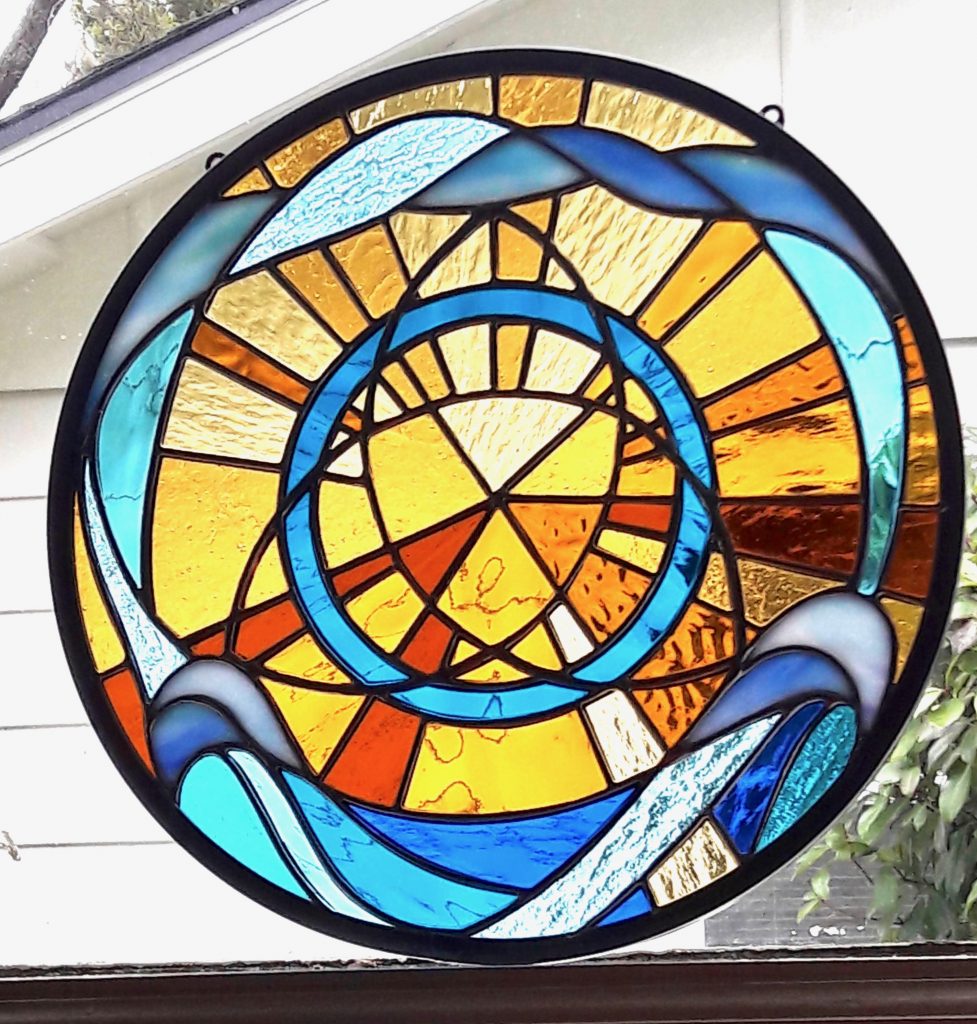Caron Art Glass Michelle Caron round panel stained glass amber blue Trinity Bright Day