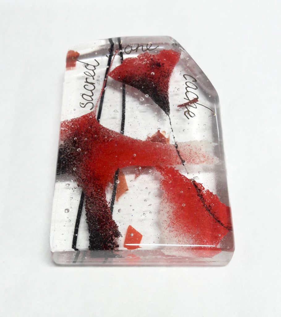 fused glass cairn with fossil vitra enameled leaves gold lettering red gray black sacred stone cache Michelle Caron Caron Art Glass