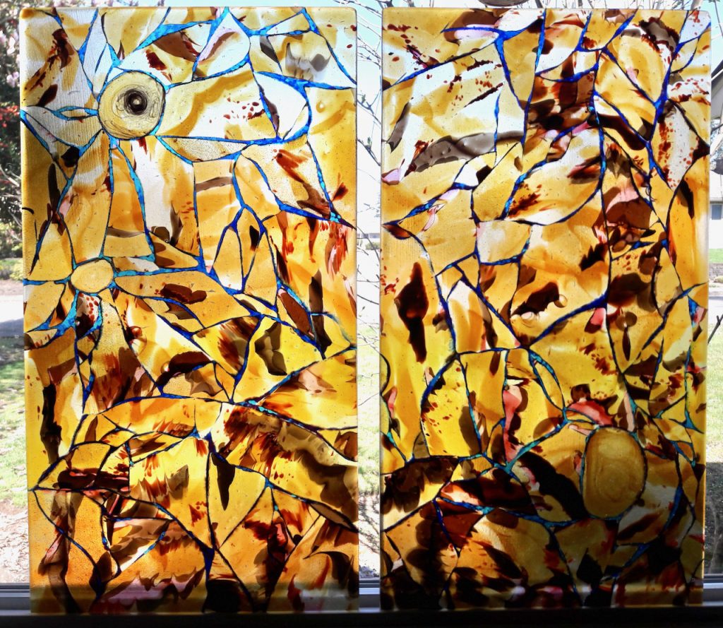 diptych of hand raked fused glass using organic chunks of amber brown coral with blue aqua purple veining Dreams of Philosophy Caron Art Glass Michelle Caron